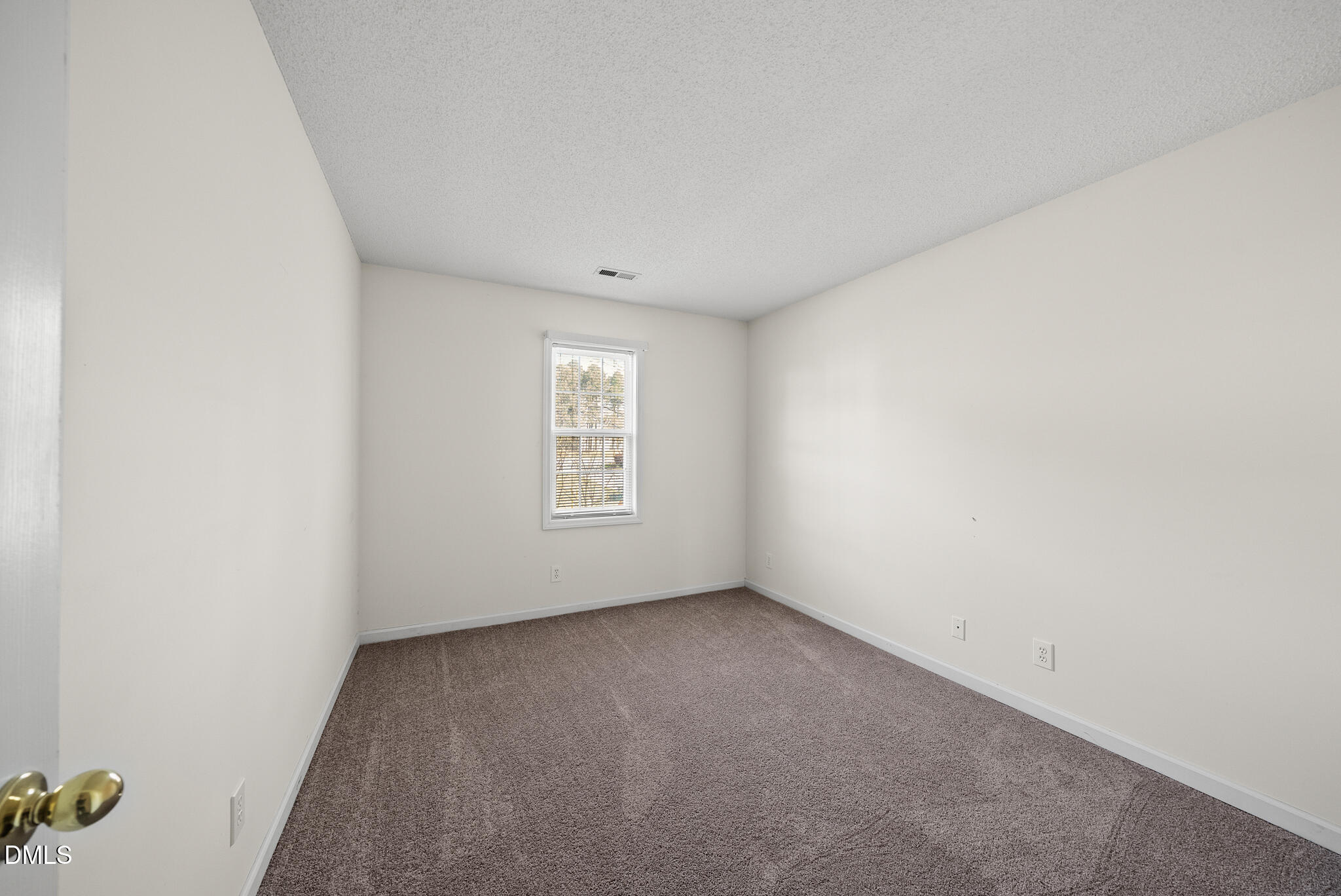 4126 Beaufain Street Raleigh, NC 27604 - Photo 17 of 36 an empty room with a window