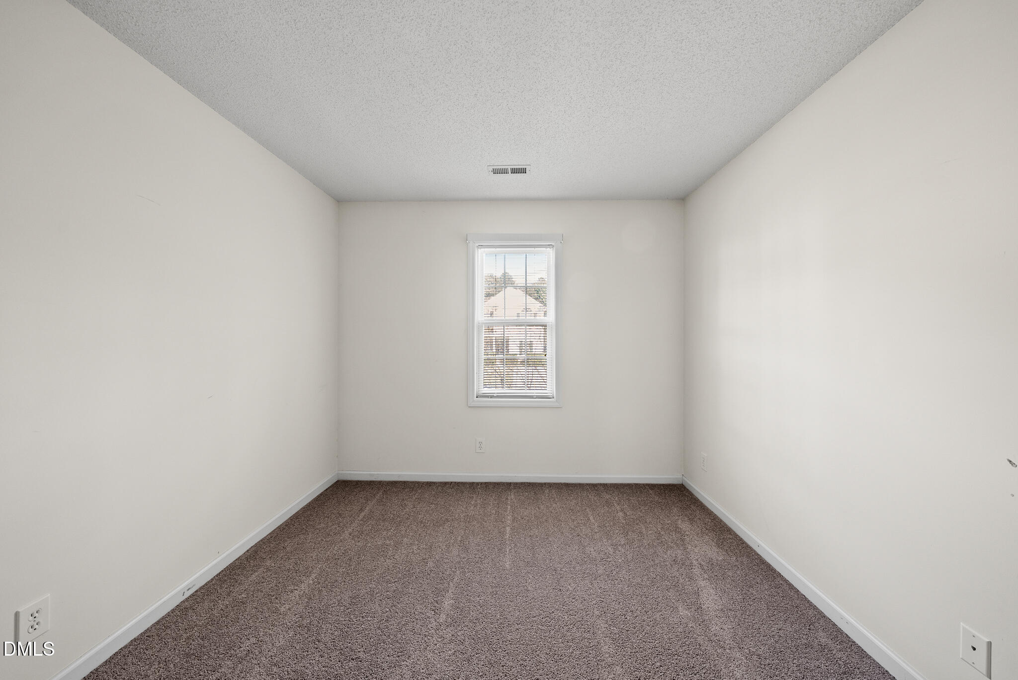 4126 Beaufain Street Raleigh, NC 27604 - Photo 18 of 36 a view of an empty room with a window