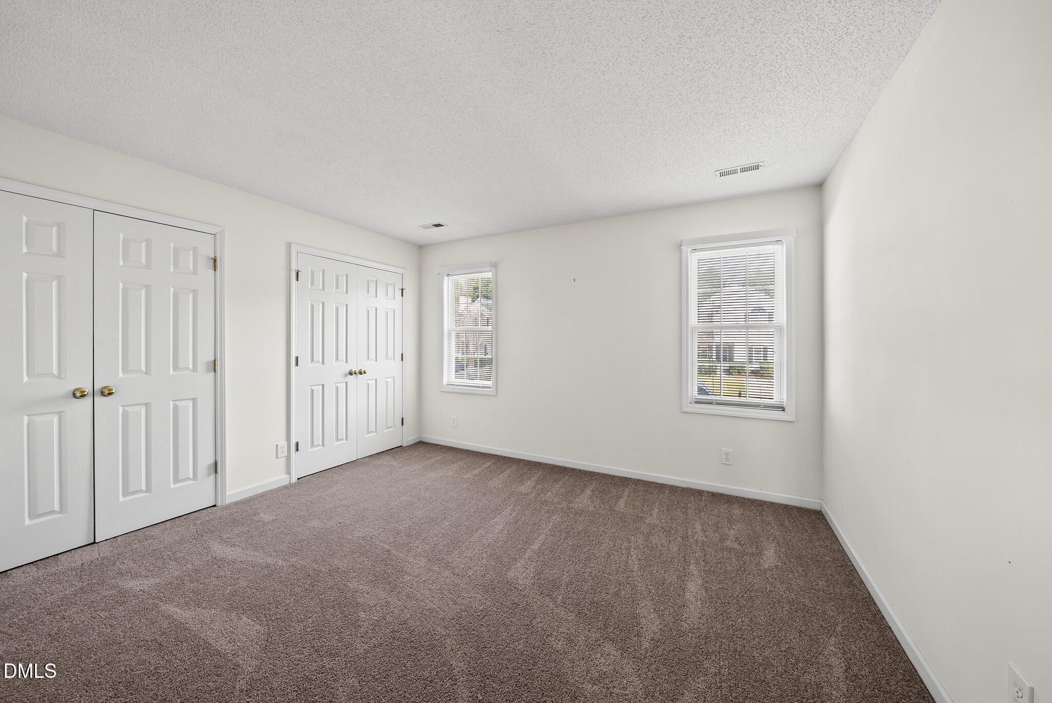 4126 Beaufain Street Raleigh, NC 27604 - Photo 19 of 36 an empty room with windows
