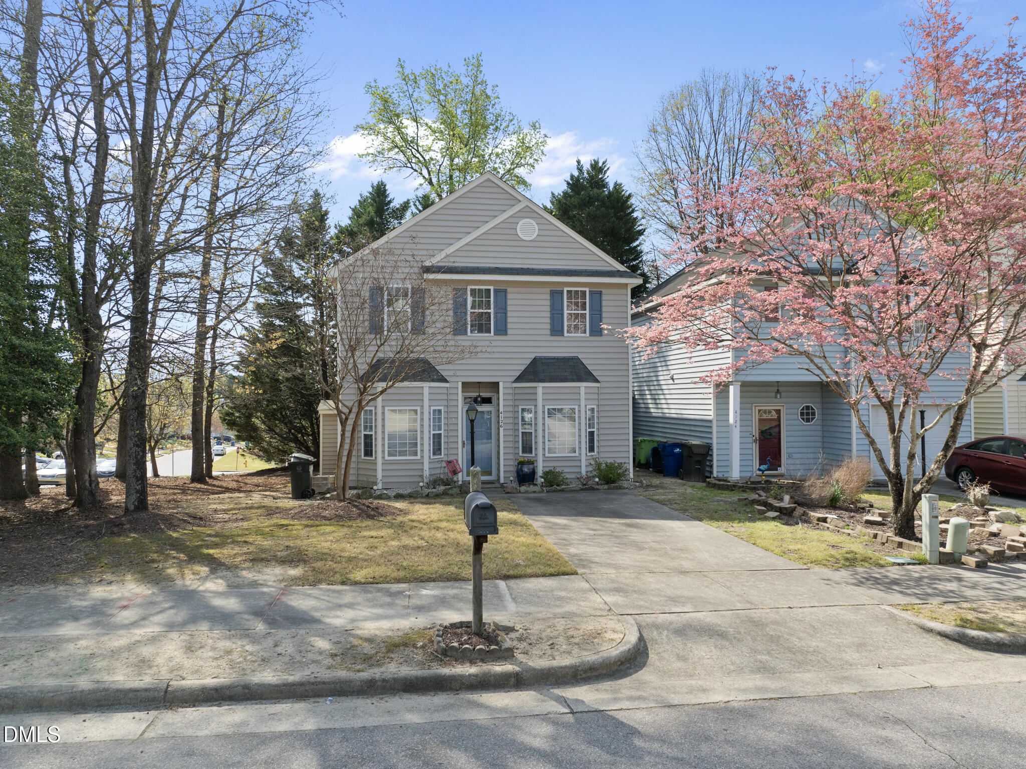4126 Beaufain Street Raleigh, NC 27604 - Photo 23 of 36 a front view of a house with a yard and trees