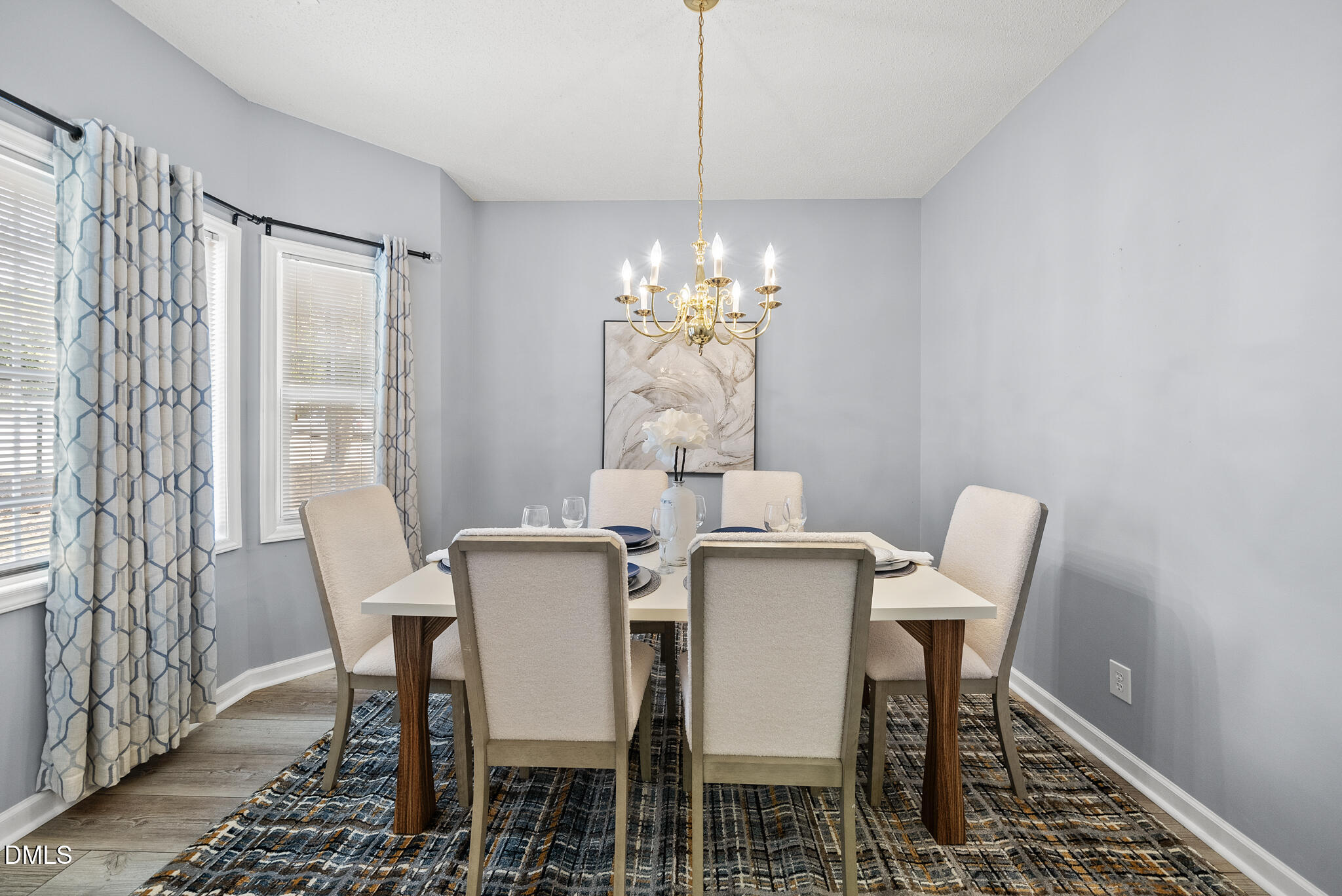 4126 Beaufain Street Raleigh, NC 27604 - Photo 2 of 36 a view of a dining room with furniture and chandelier