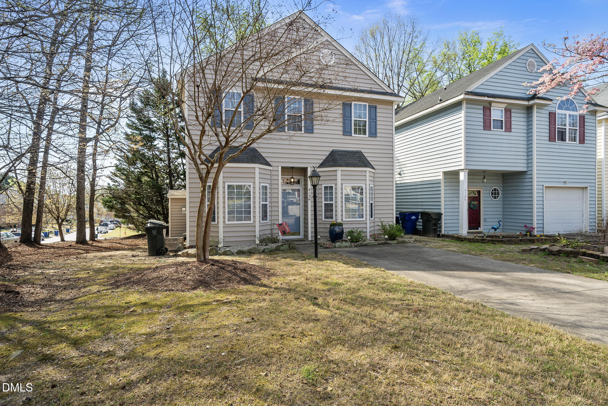 4126 Beaufain Street Raleigh, NC 27604 - Photo 29 of 36 a view of a house with a yard and large tree