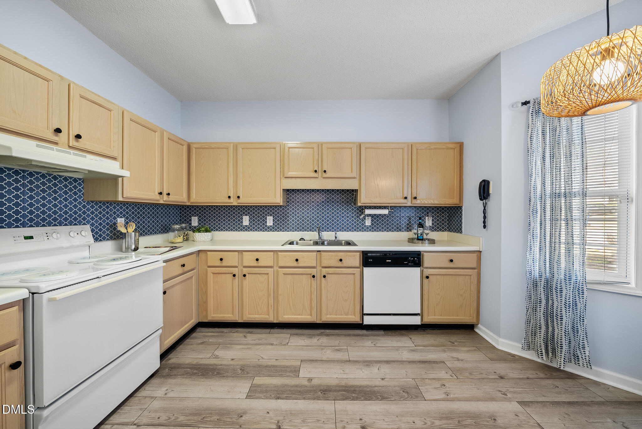 4126 Beaufain Street Raleigh, NC 27604 - Photo 4 of 36 a kitchen with granite countertop a sink and cabinets