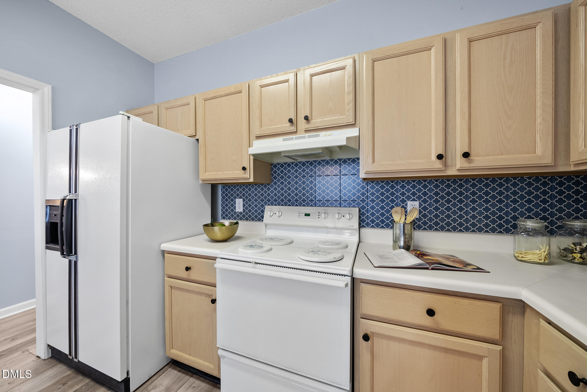 4126 Beaufain Street Raleigh, NC 27604 - Photo 7 of 36 a kitchen with appliances a sink and cabinets