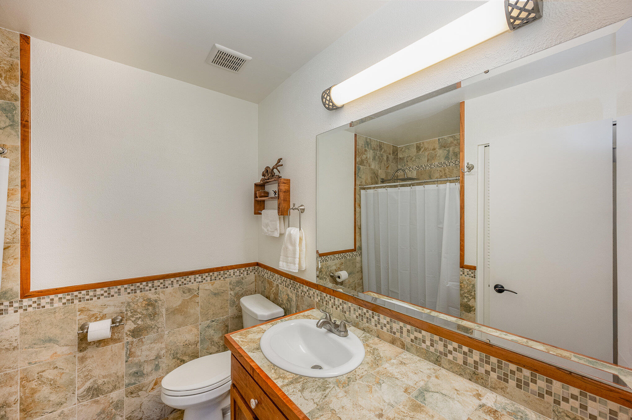 1562 Creel Road Northeast Palm Bay, FL 32905 - Photo 13 of 23 a bathroom with a granite countertop sink and a mirror