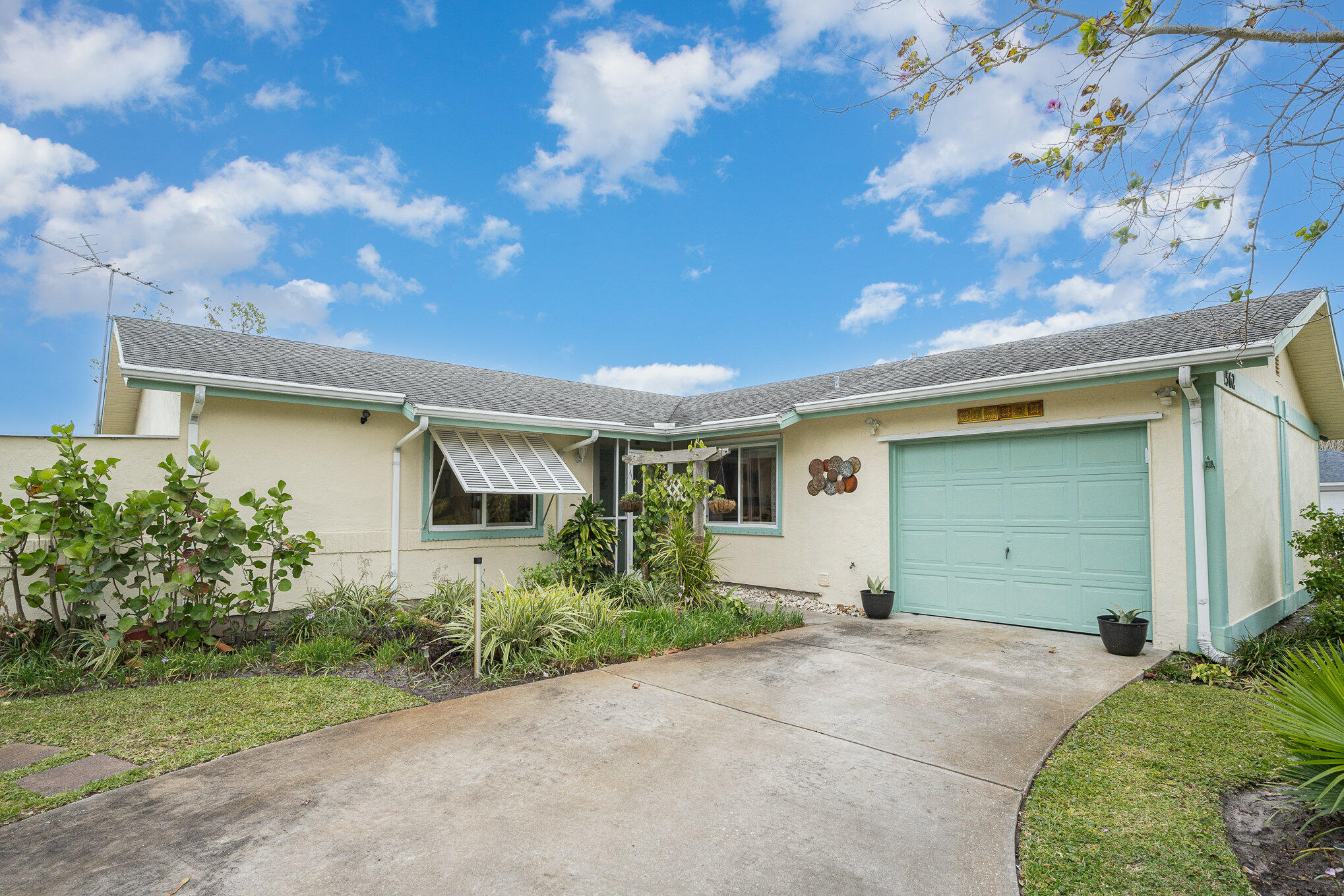 1562 Creel Road Northeast Palm Bay, FL 32905 - Photo 3 of 23 a front view of house with yard