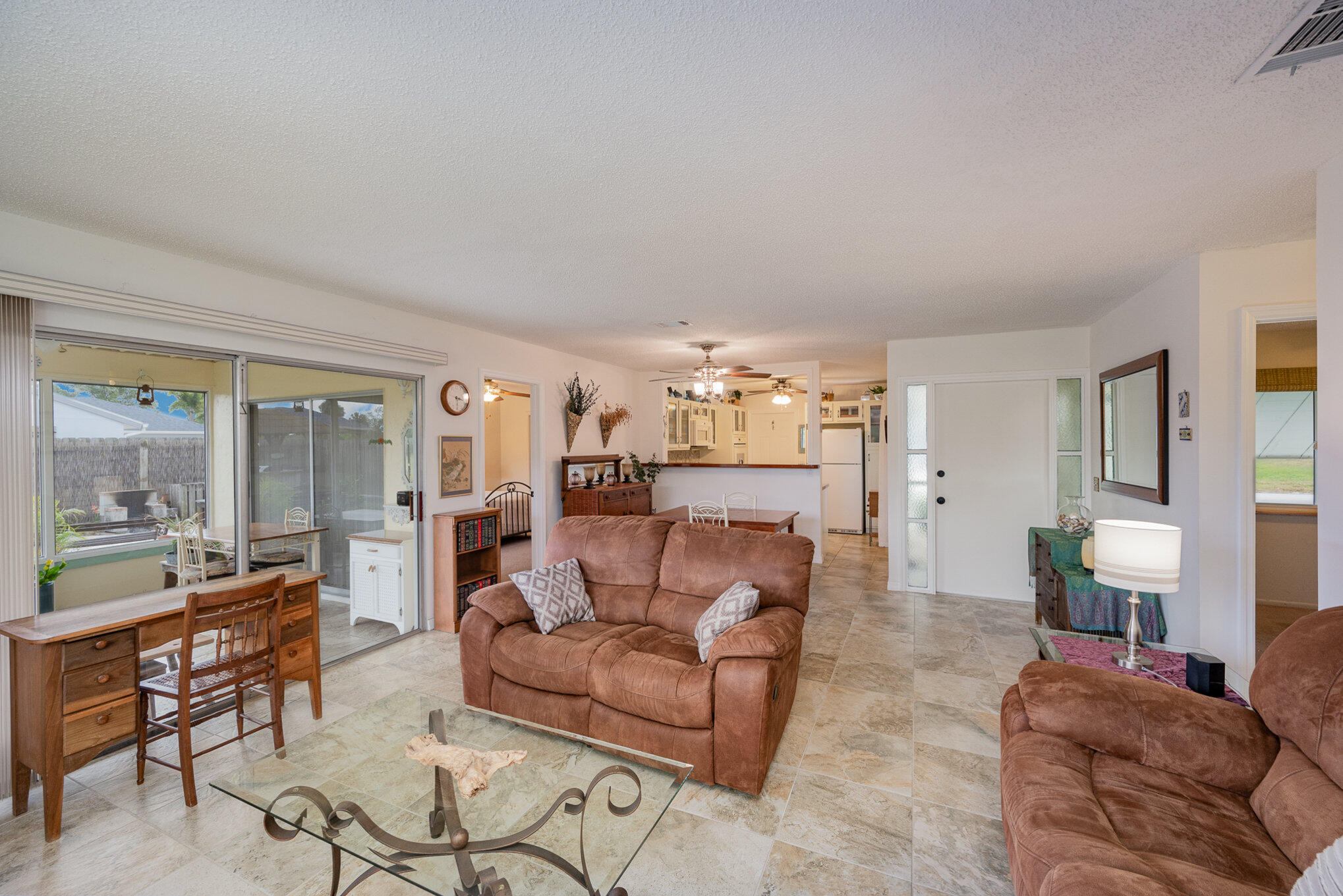 1562 Creel Road Northeast Palm Bay, FL 32905 - Photo 5 of 23 a living room with furniture and a large window