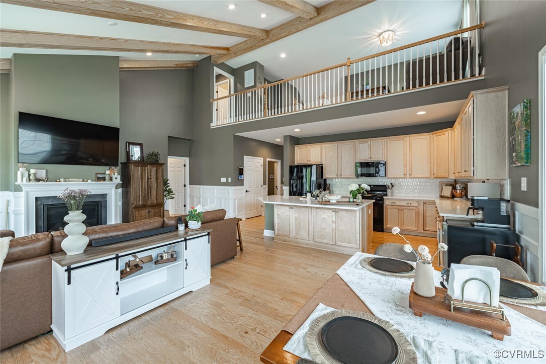 15813 Maclear Drive Midlothian, VA 23112 - Photo 12 of 38 a kitchen with stainless steel appliances granite countertop a stove a sink dishwasher a refrigerator and white cabinets with wooden floor