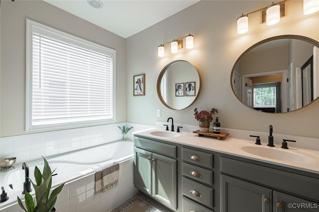 15813 Maclear Drive Midlothian, VA 23112 - Photo 15 of 38 a bathroom with a double vanity sink and a mirror