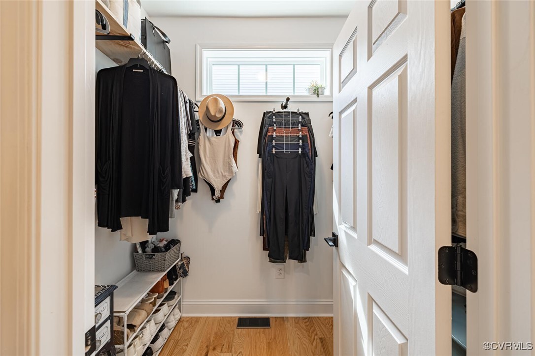 15813 Maclear Drive Midlothian, VA 23112 - Photo 18 of 38 a view of walk in closet with clothes and shoes