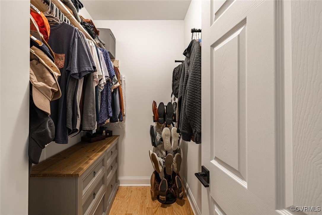 15813 Maclear Drive Midlothian, VA 23112 - Photo 19 of 38 a view of walk in closet with clothes and shoes