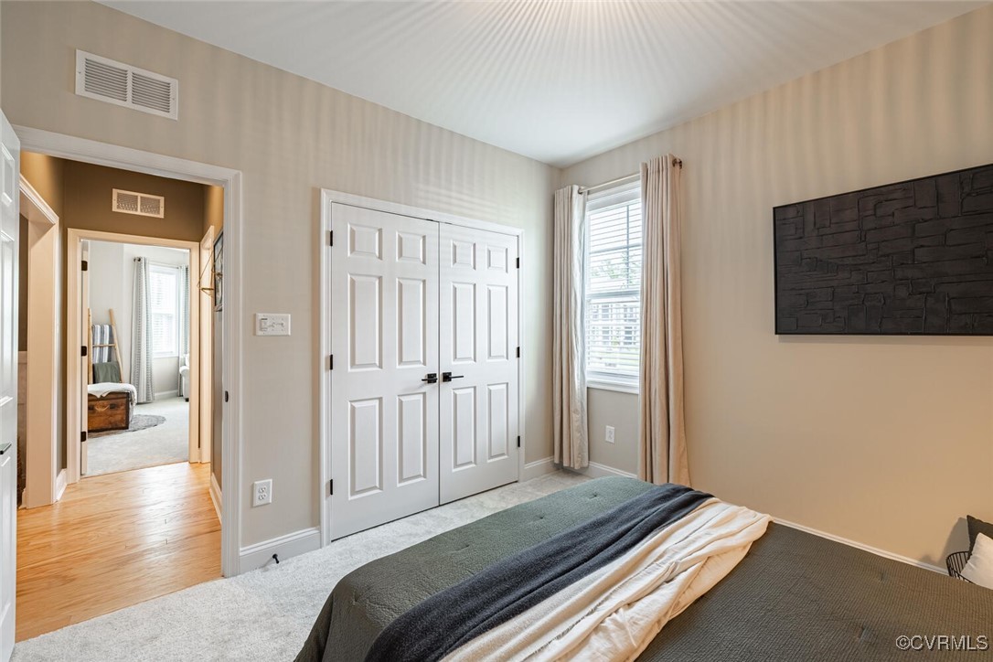 15813 Maclear Drive Midlothian, VA 23112 - Photo 23 of 38 a bedroom with a bed and wooden floor