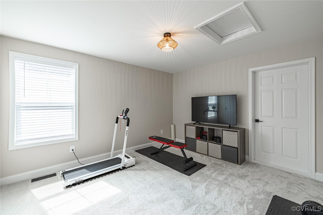 15813 Maclear Drive Midlothian, VA 23112 - Photo 26 of 38 a room with gym equipment and a flat screen tv