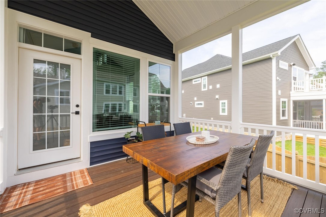 15813 Maclear Drive Midlothian, VA 23112 - Photo 33 of 38 a view of a dinning table and chairs in patio of the house