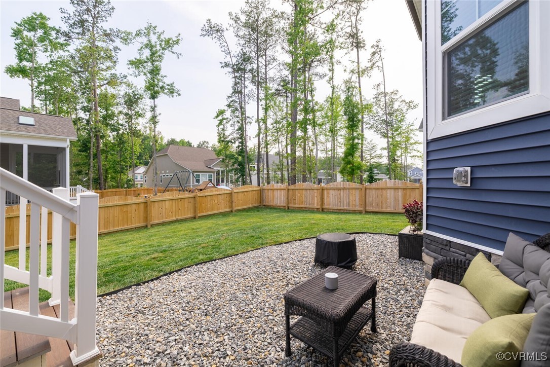 15813 Maclear Drive Midlothian, VA 23112 - Photo 34 of 38 a view of a deck with couches plants and large garden