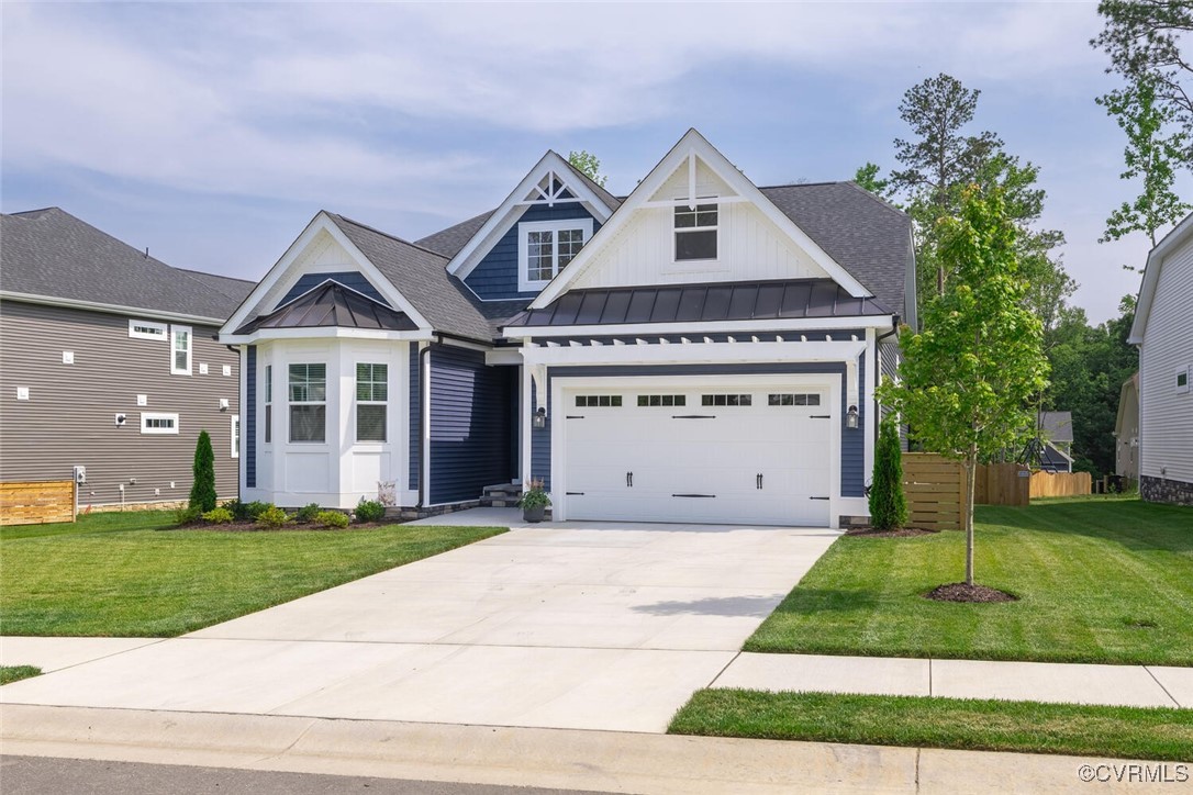 15813 Maclear Drive Midlothian, VA 23112 - Photo 38 of 38 a front view of a house with a yard and garage