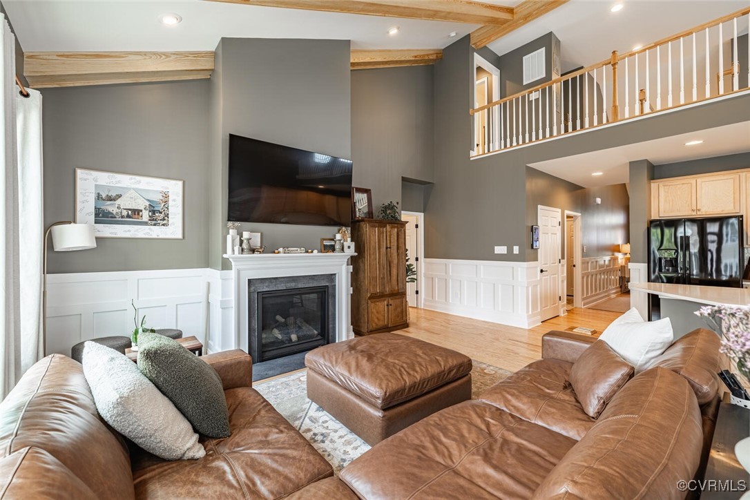 15813 Maclear Drive Midlothian, VA 23112 - Photo 5 of 38 a living room with furniture a flat screen tv and a fireplace