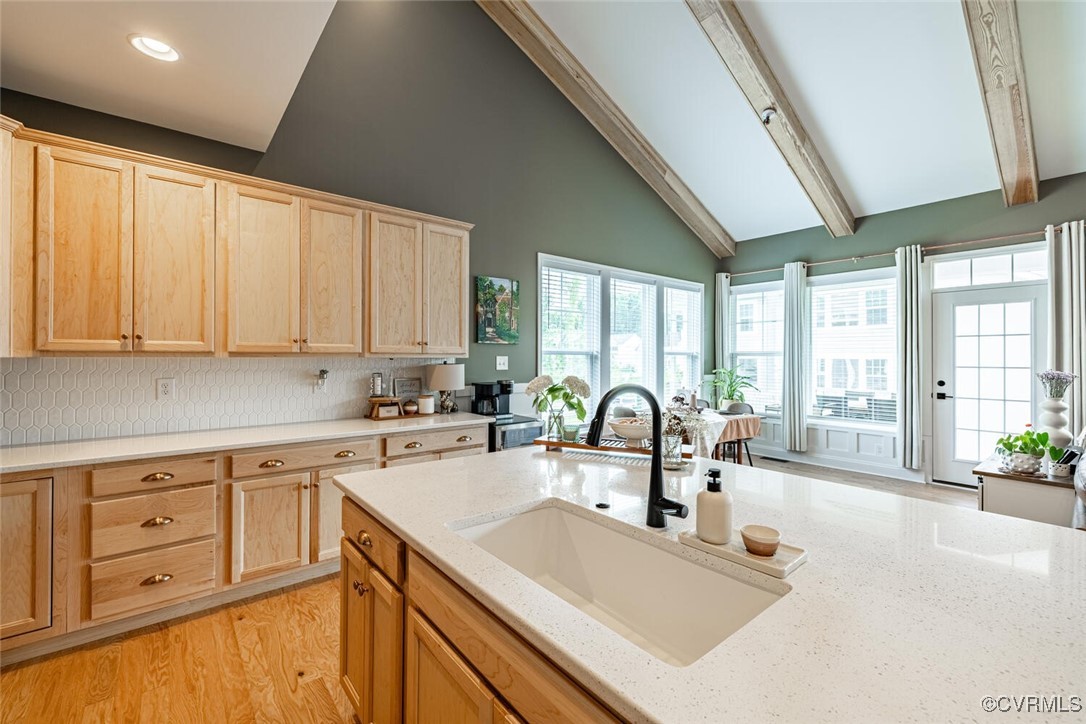 15813 Maclear Drive Midlothian, VA 23112 - Photo 10 of 38 a kitchen with kitchen island a sink appliances cabinets and a large window