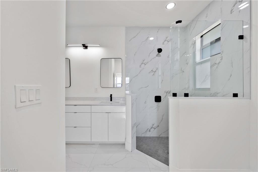 228 Connecticut Road Lehigh Acres, FL 33936 - Photo 11 of 21 a spacious bathroom with a shower