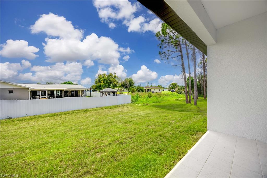 228 Connecticut Road Lehigh Acres, FL 33936 - Photo 20 of 21 a view of an outdoor space and swimming pool