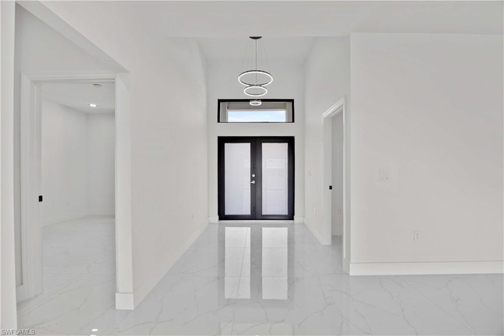 228 Connecticut Road Lehigh Acres, FL 33936 - Photo 4 of 21 a view of front door with a mirror