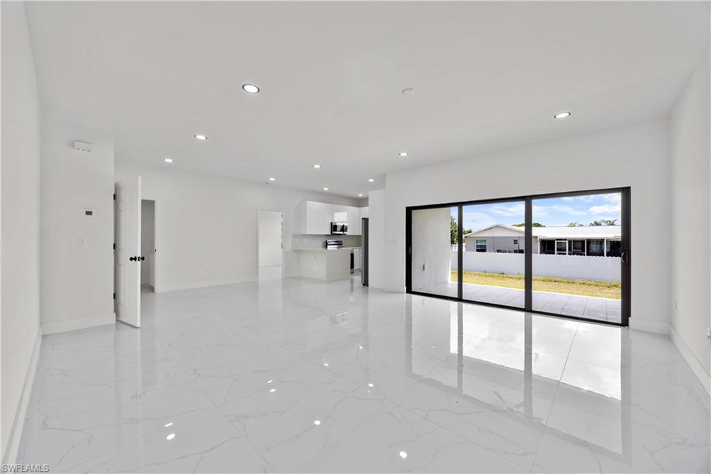 228 Connecticut Road Lehigh Acres, FL 33936 - Photo 5 of 21 a view of a hallway