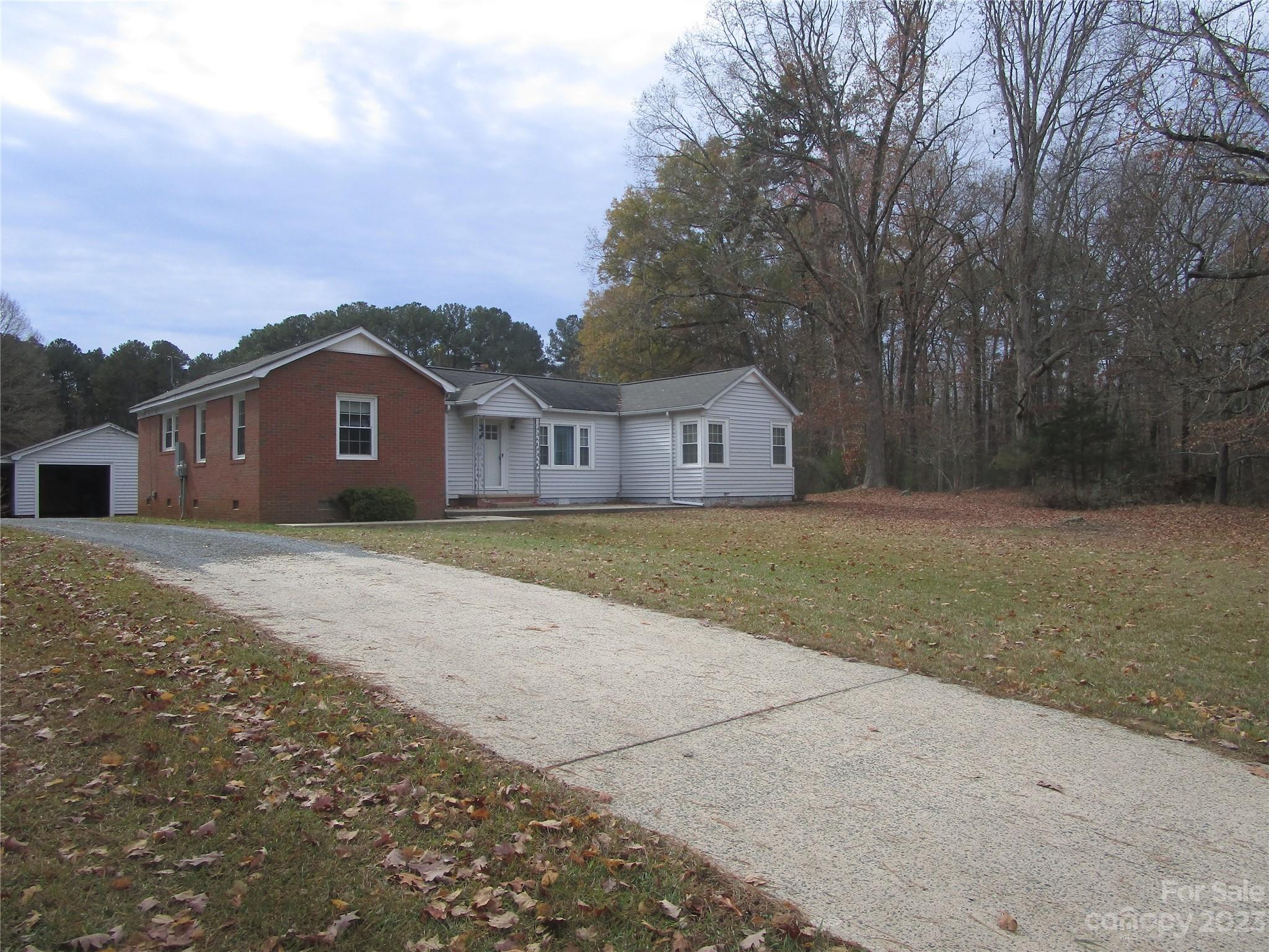 3508 Highway 74 Monroe, NC 28112 - Photo 12 of 28 a view of house with a big yard and large trees