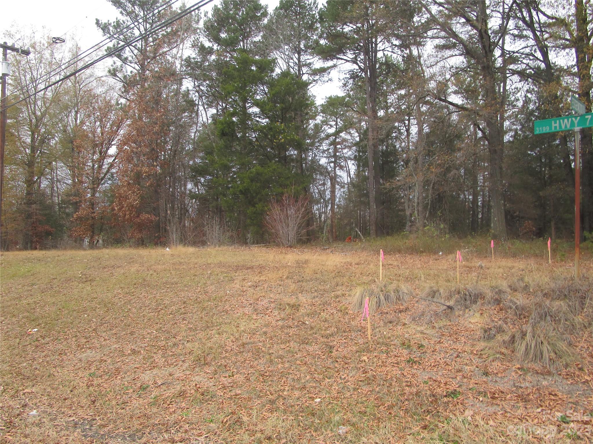 3508 Highway 74 Monroe, NC 28112 - Photo 26 of 28 a backyard of a house with lots of green space