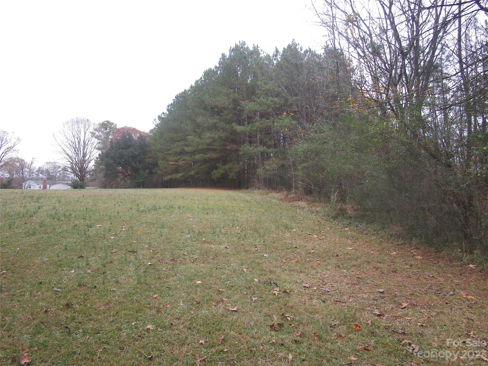 3508 Highway 74 Monroe, NC 28112 - Photo 6 of 28 a view of a field with trees in the background