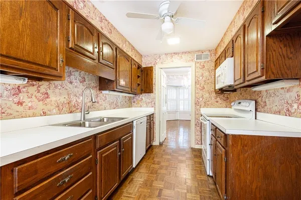 a kitchen with a sink and cabinets