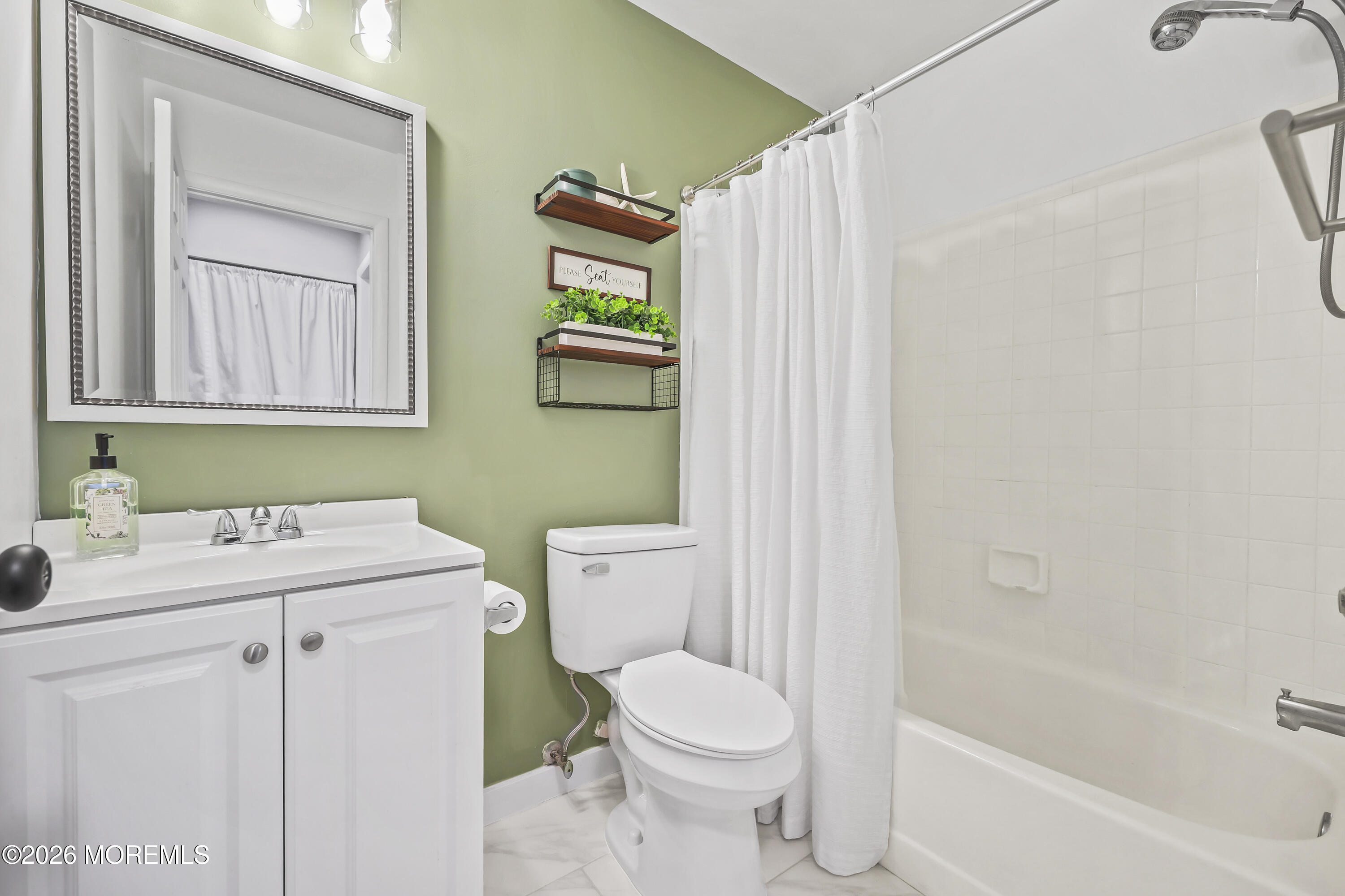 710 Ivy Court Jackson, NJ 08527 - Photo 19 of 21 a bathroom with a sink a toilet and a mirror