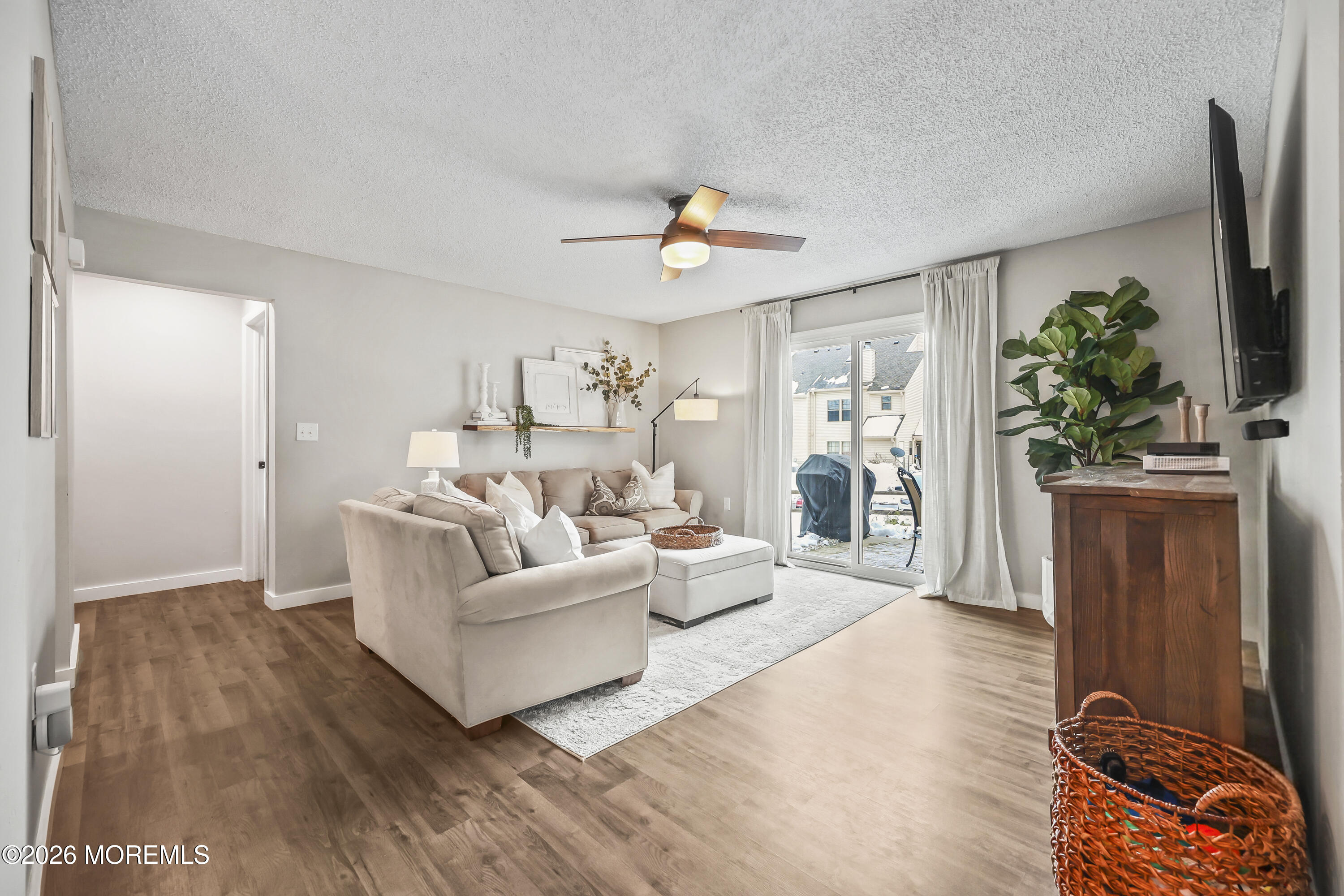 710 Ivy Court Jackson, NJ 08527 - Photo 10 of 21 a living room with furniture and a flat screen tv