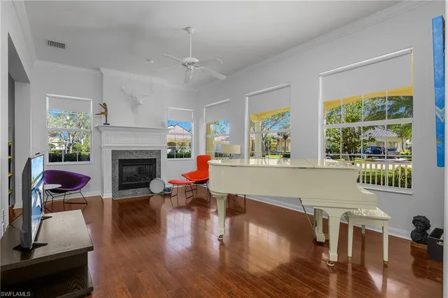 a living room with furniture fireplace and window