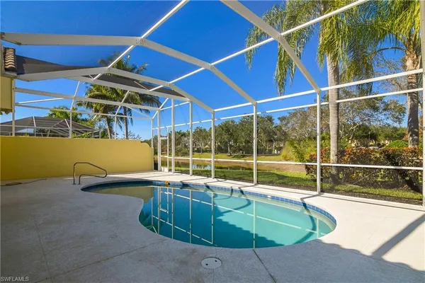 a view of a swimming pool with a lounge chair