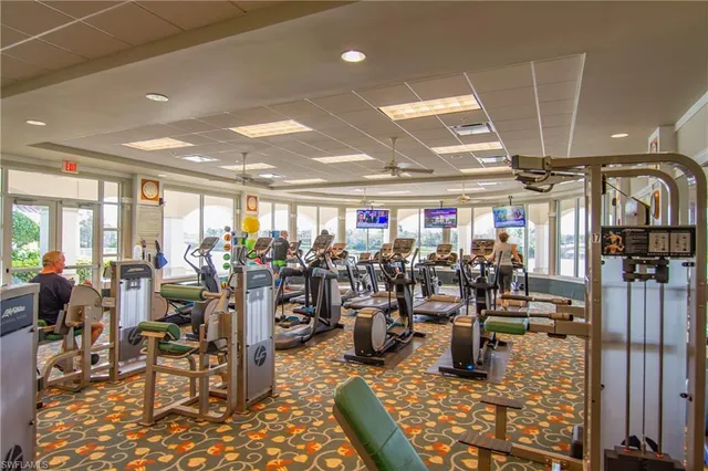 a room with lots of chairs and gym equipment