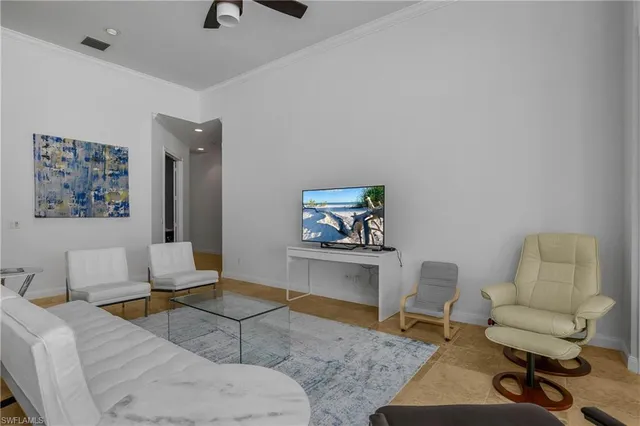 a living room with furniture and a rug