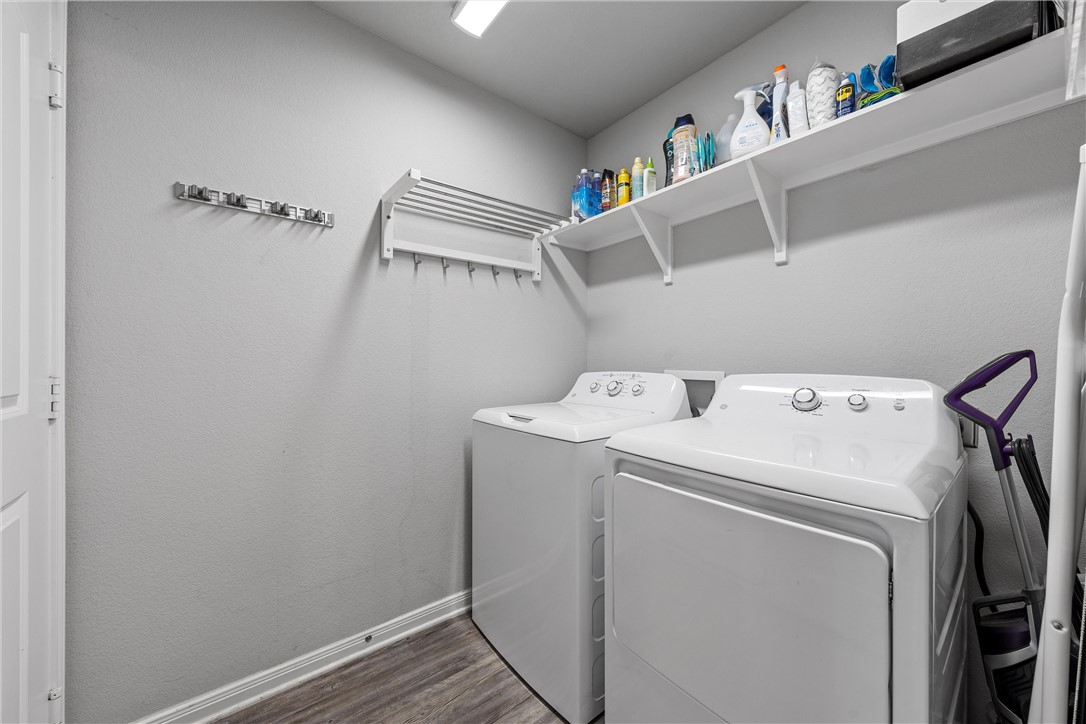 4016 Bravo Ranch Road Waco, TX 76705 - Photo 25 of 38 a utility room with dryer and washer