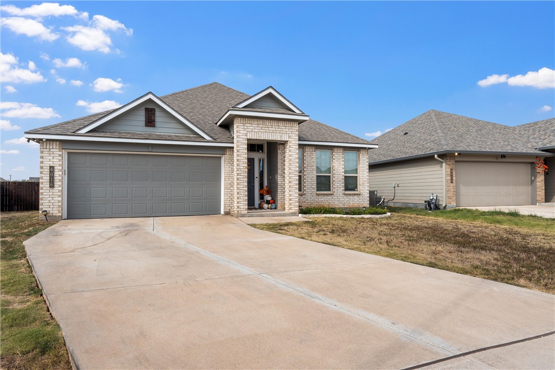 4016 Bravo Ranch Road Waco, TX 76705 - Photo 3 of 38 a front view of a house with a yard and garage