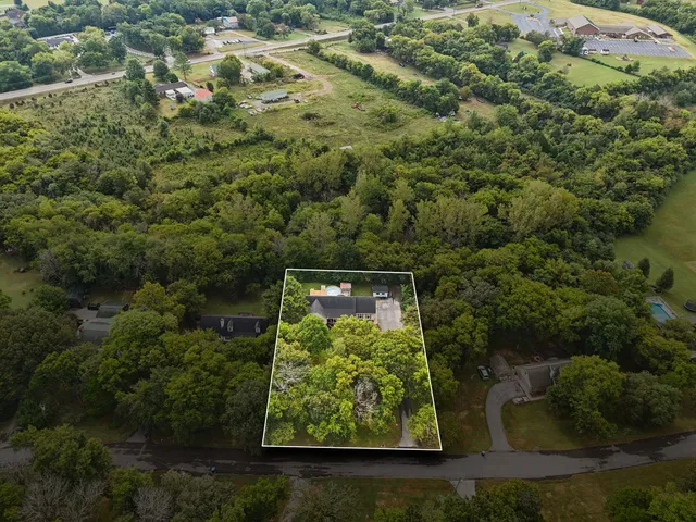 front view of a house with a garden