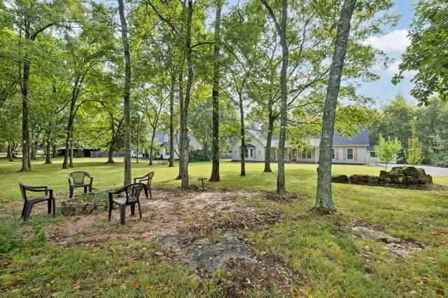 a backyard of a house with outdoor seating