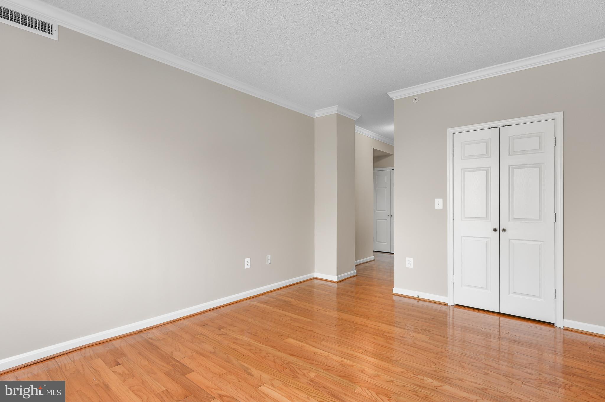19355 Cypress Ridge Terrace, Unit 219 Leesburg, VA 20176 - Photo 23 of 42 a view of an empty room and wooden floor