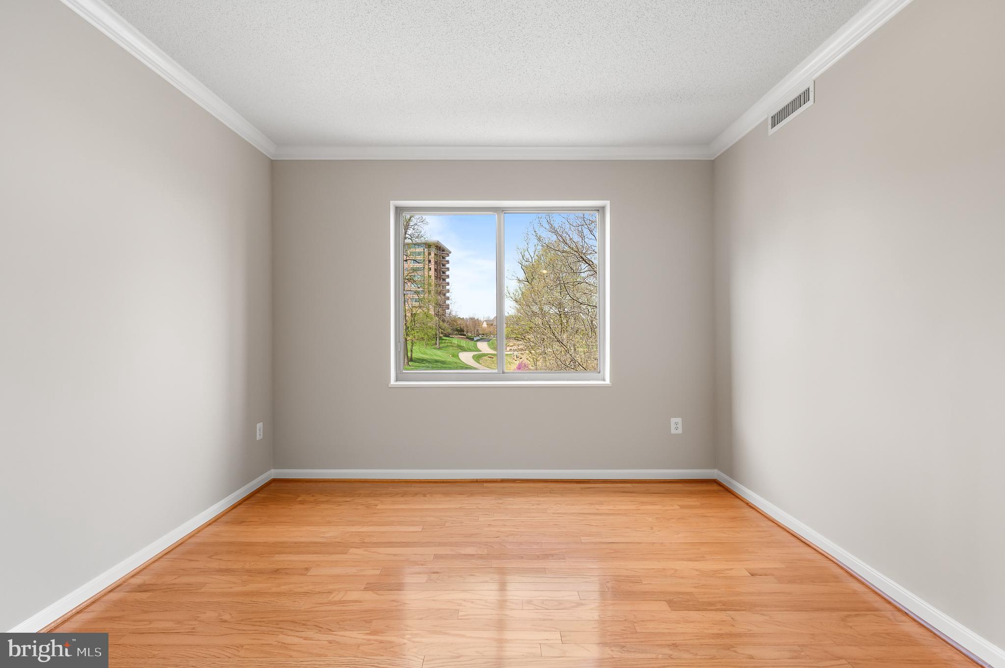 19355 Cypress Ridge Terrace, Unit 219 Leesburg, VA 20176 - Photo 24 of 42 an empty room with a window