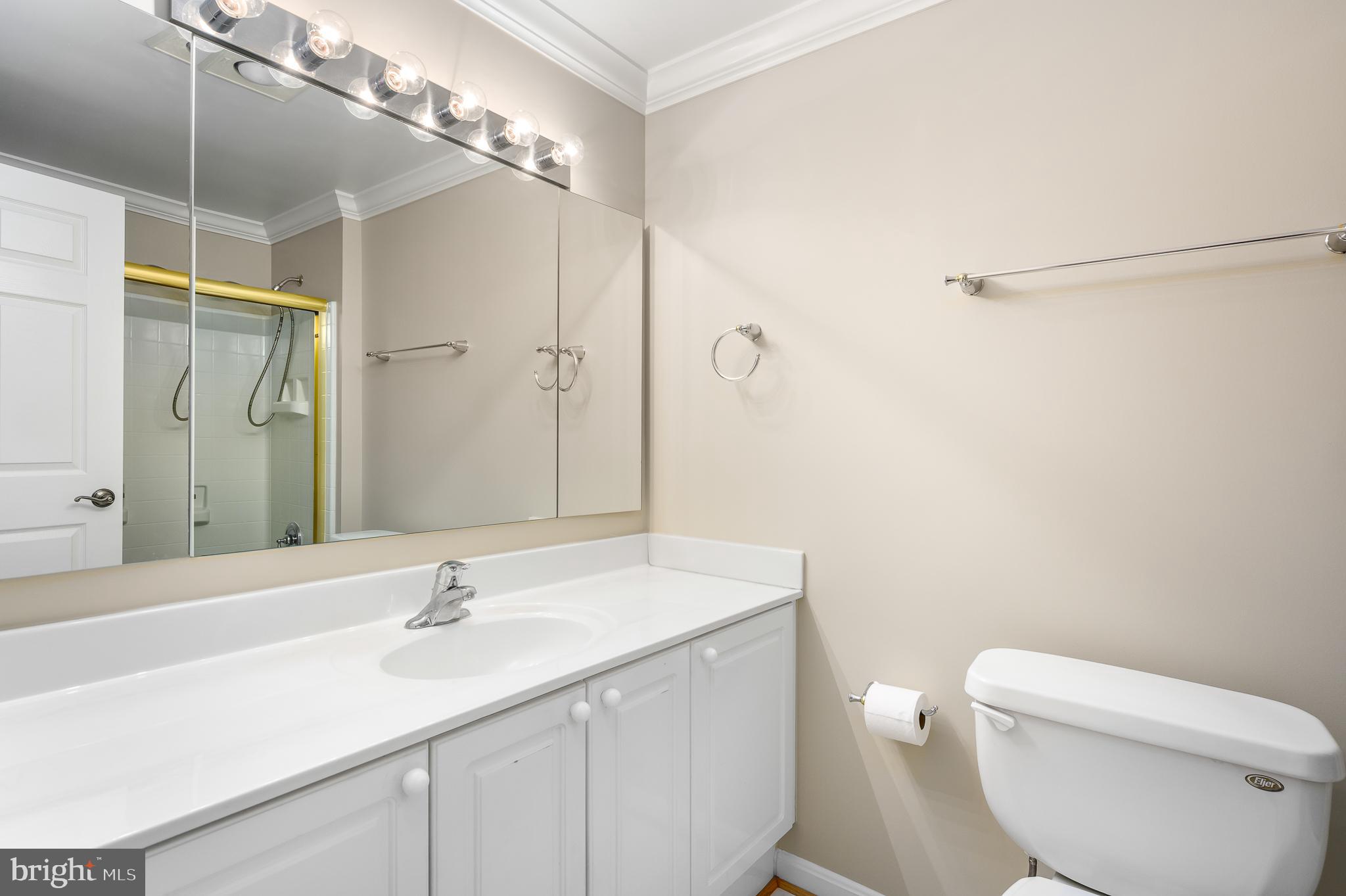 19355 Cypress Ridge Terrace, Unit 219 Leesburg, VA 20176 - Photo 30 of 42 a bathroom with a sink toilet and shower