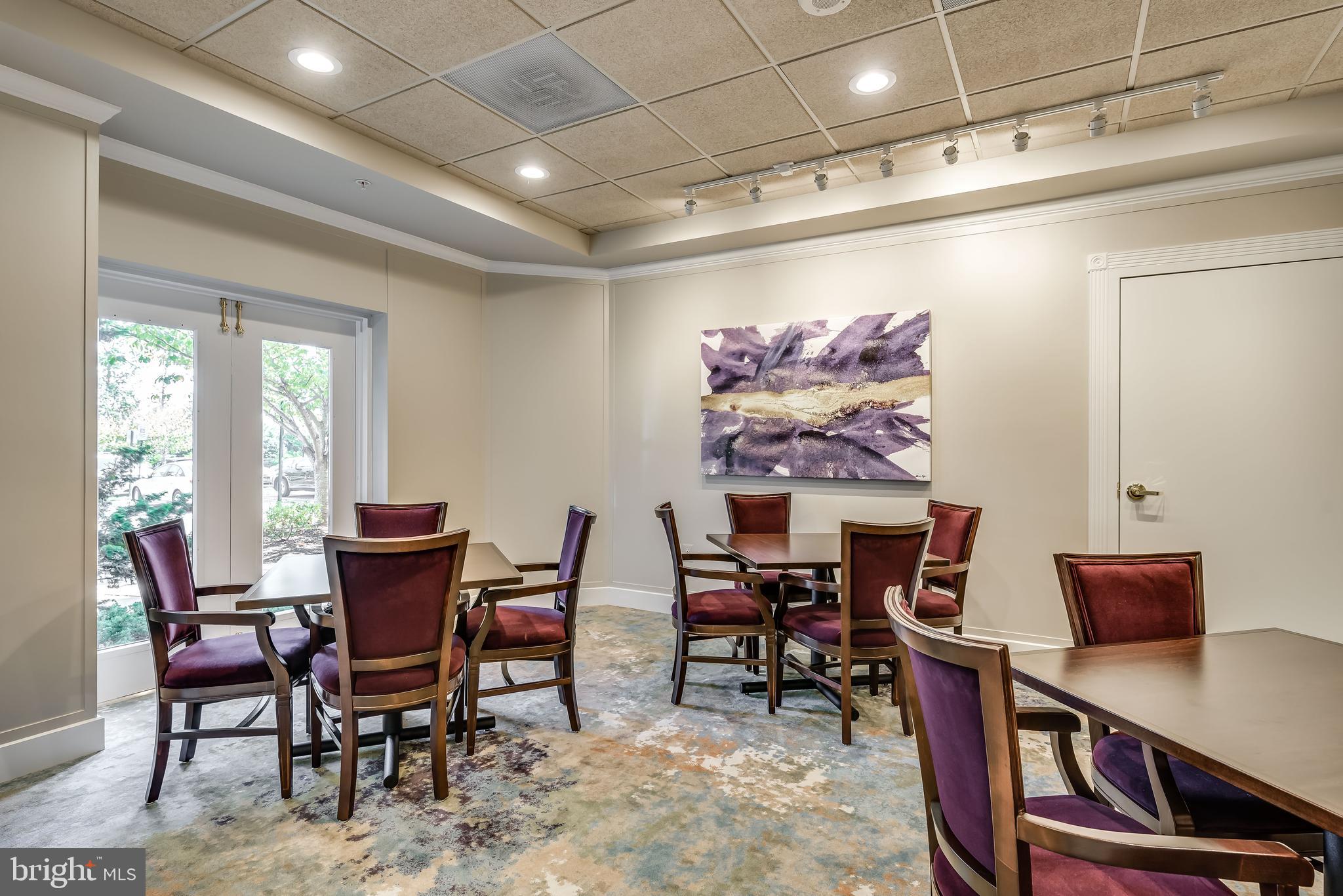 19355 Cypress Ridge Terrace, Unit 219 Leesburg, VA 20176 - Photo 35 of 42 a view of a dining room with furniture