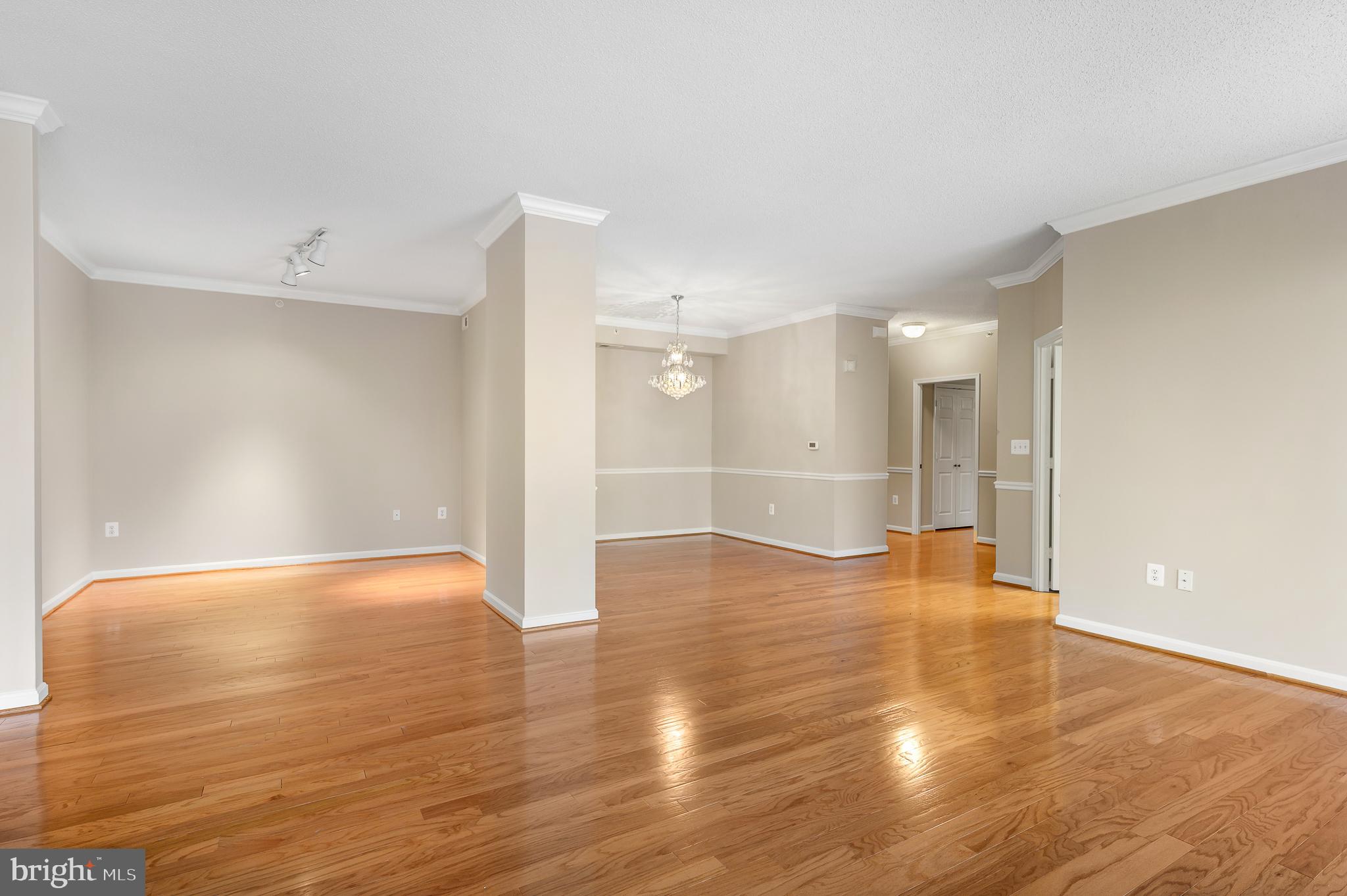 19355 Cypress Ridge Terrace, Unit 219 Leesburg, VA 20176 - Photo 5 of 42 a view of an empty room with wooden floor