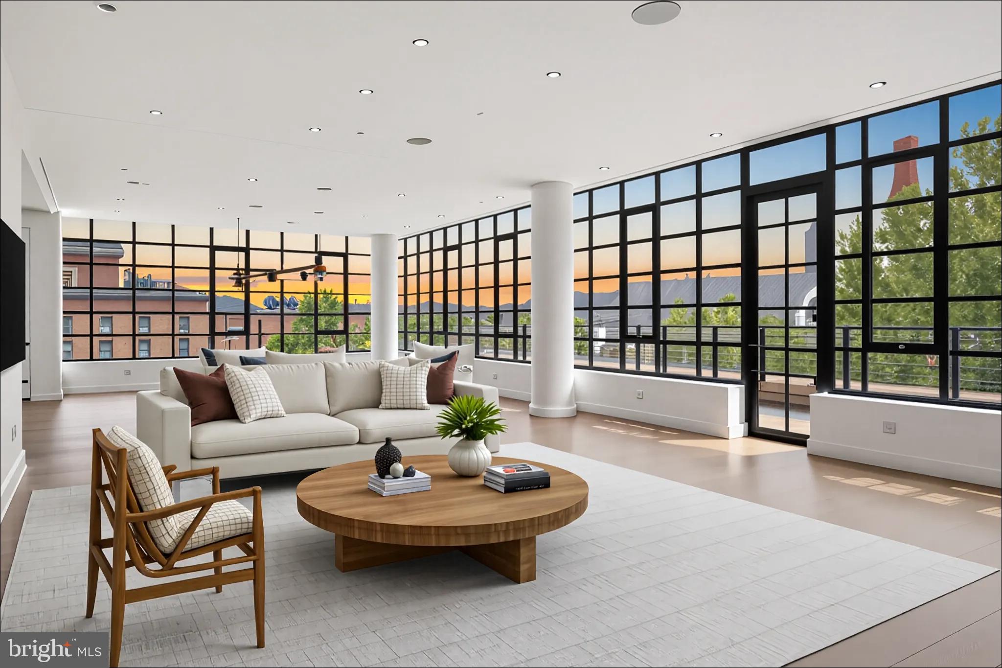 1055 Wisconsin Avenue Northwest, Unit 4E Washington, DC 20007 - Photo 54 of 58 a living room with furniture and a large window