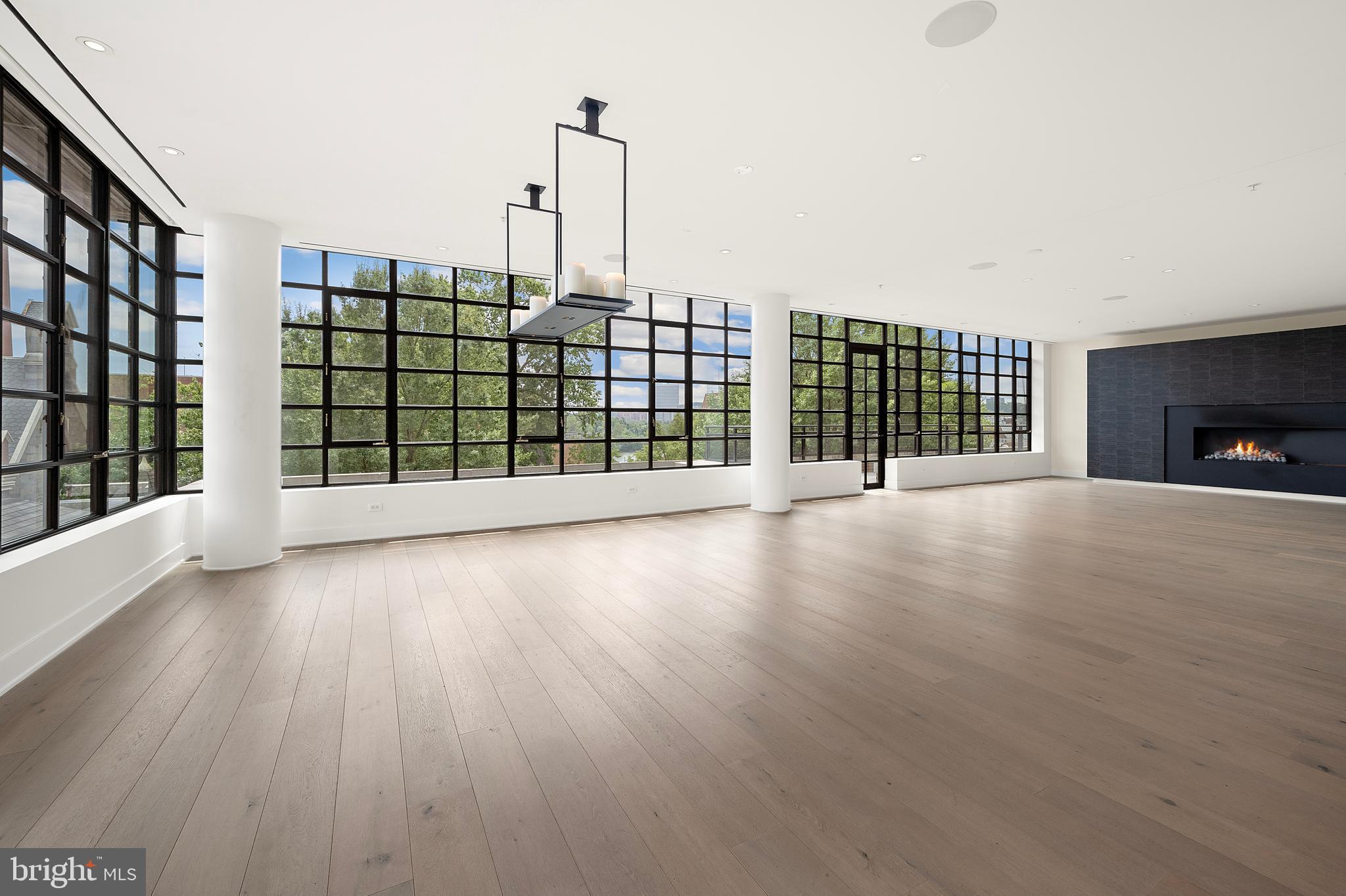 1055 Wisconsin Avenue Northwest, Unit 4E Washington, DC 20007 - Photo 14 of 58 a view of livingroom with furniture and floor to ceiling window