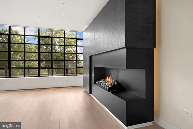 a view of a living room and a floor to ceiling window