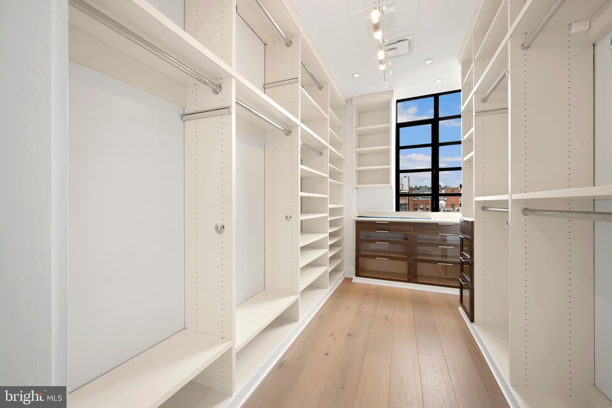1055 Wisconsin Avenue Northwest, Unit 4E Washington, DC 20007 - Photo 26 of 58 a view of walk in closet with empty racks