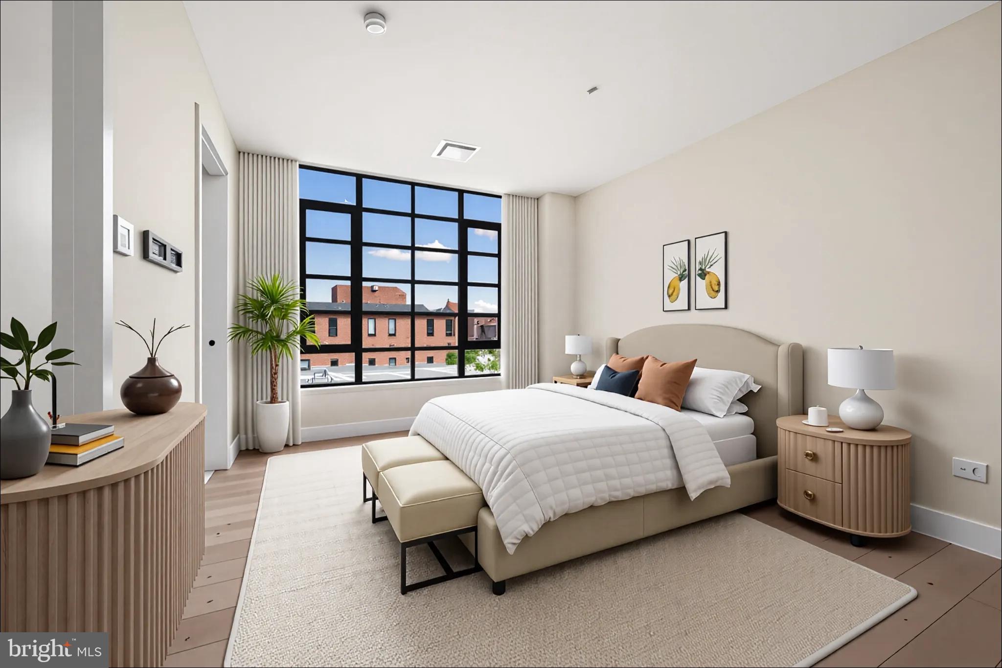 1055 Wisconsin Avenue Northwest, Unit 4E Washington, DC 20007 - Photo 31 of 58 a bedroom with a bed and a large window